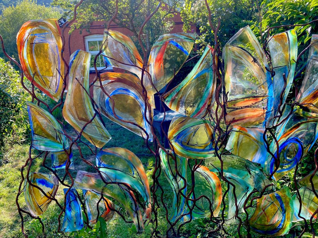 this is a 24 piece glass and metal screen, dimensions 160cm x 140cm